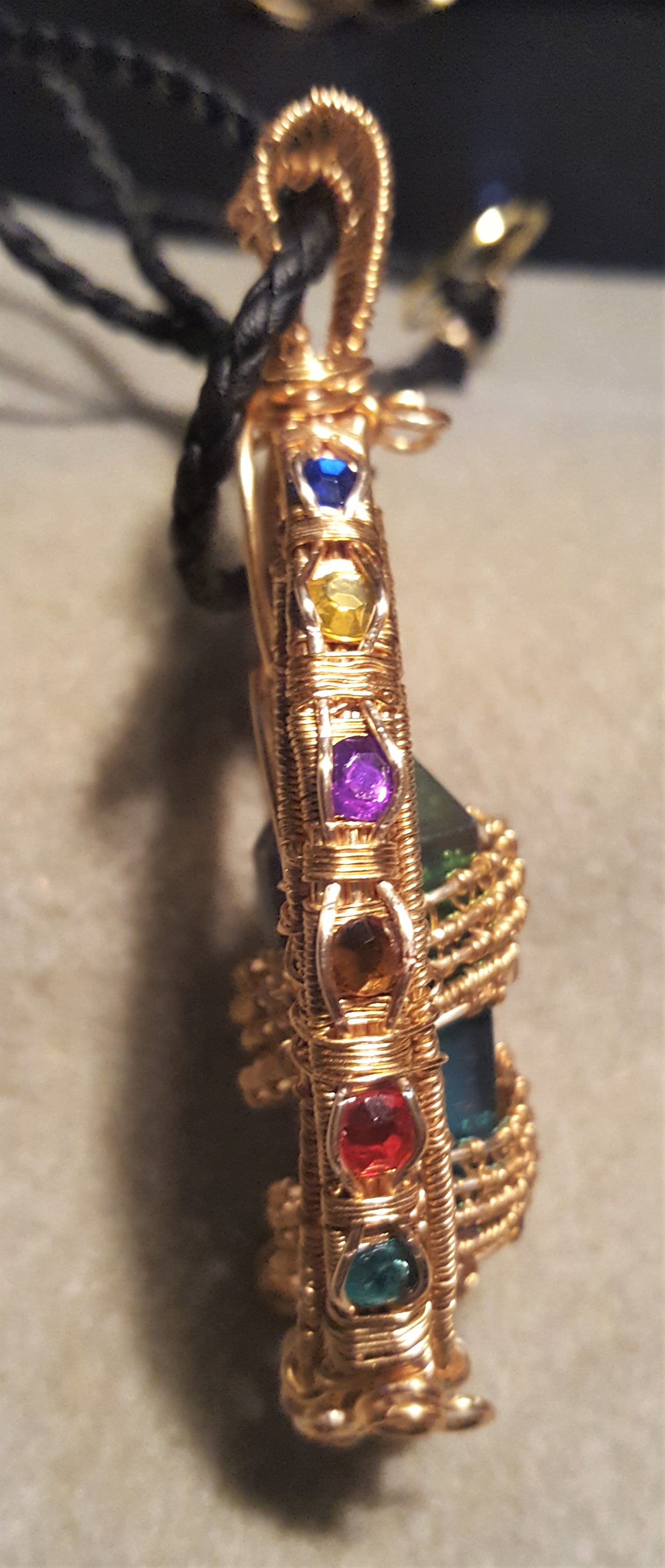 Gold Suncatcher With An Iridescent Crystal Point