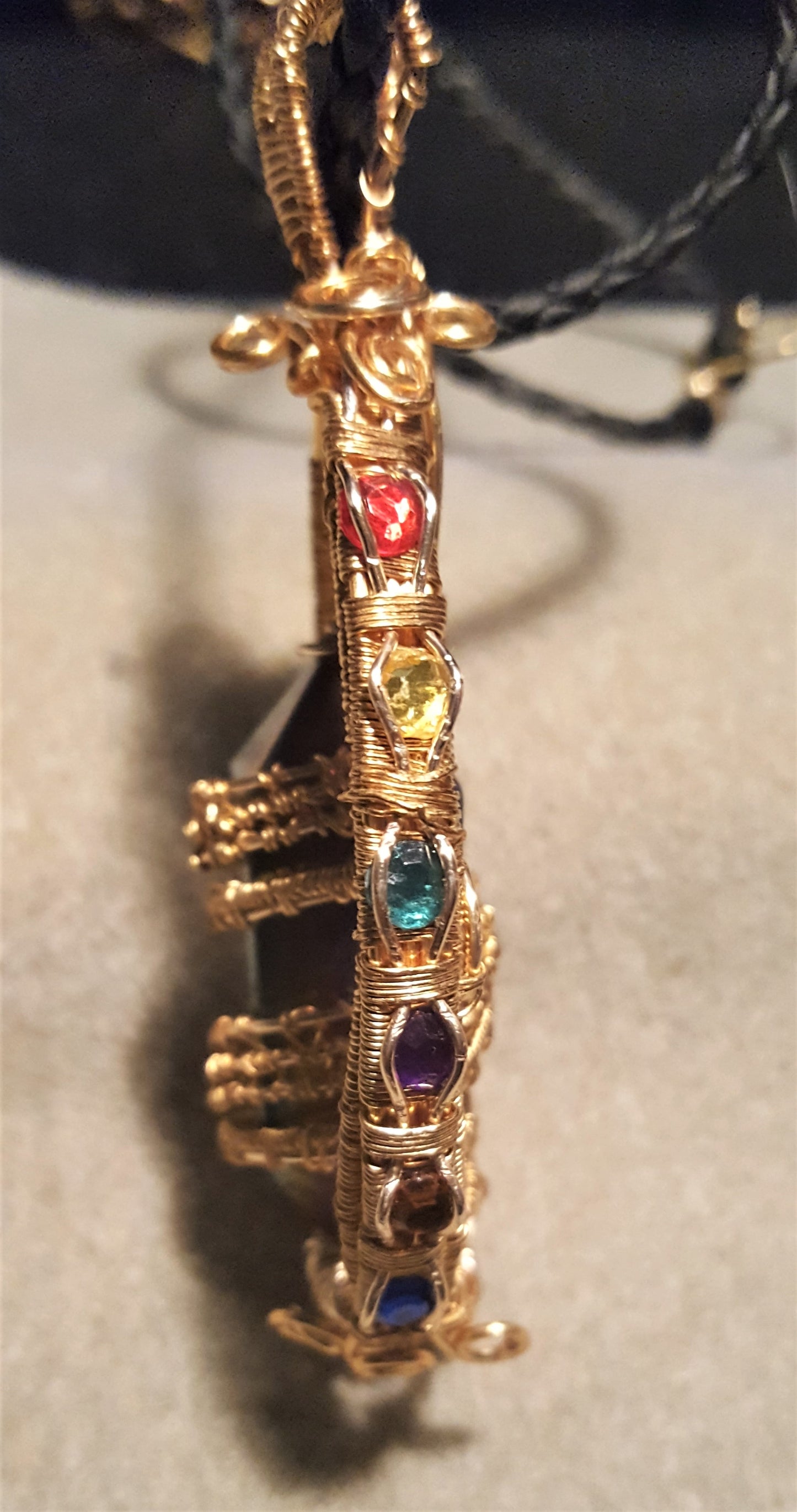 Gold Suncatcher With An Iridescent Crystal Point