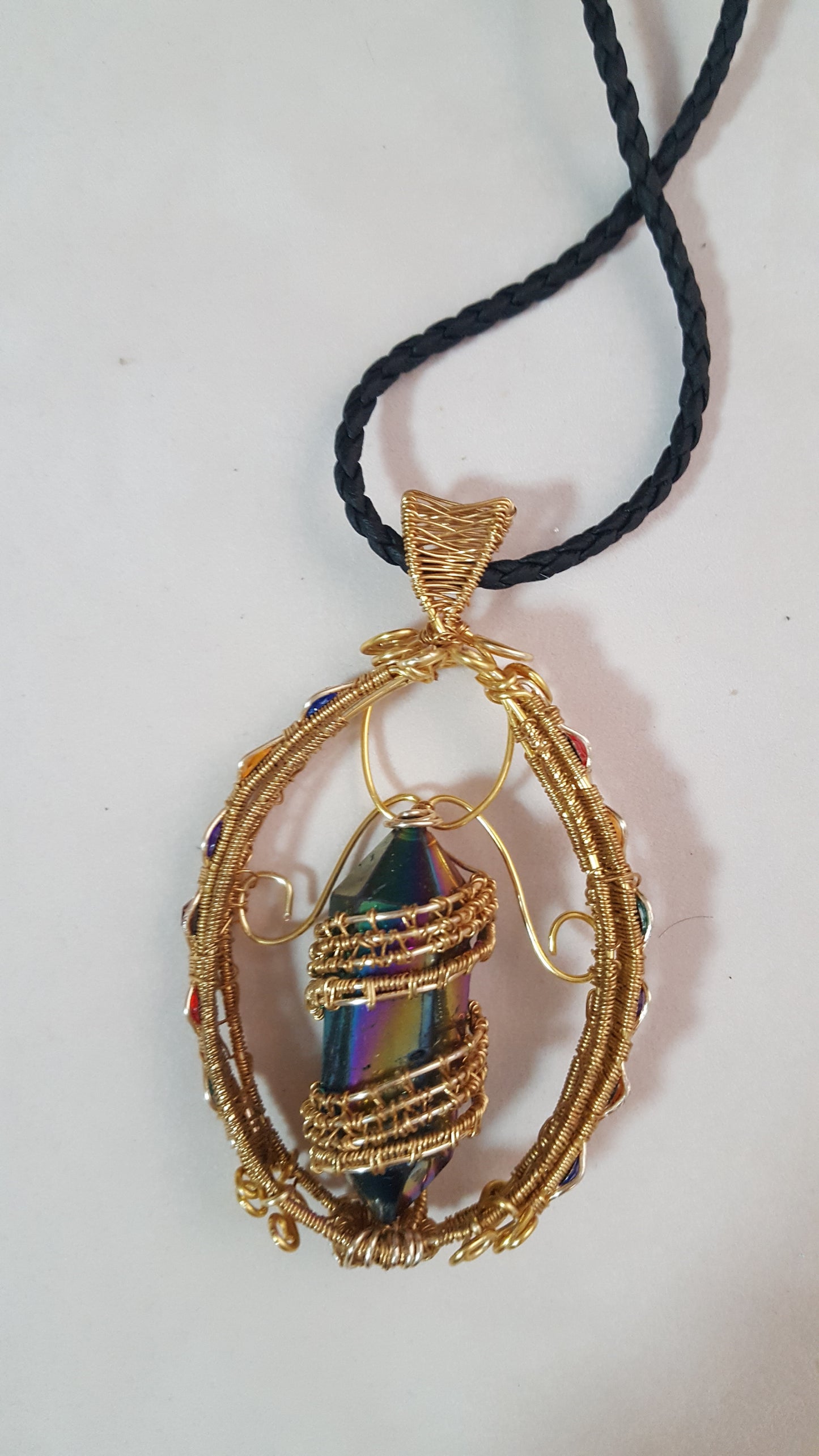 Gold Suncatcher With An Iridescent Crystal Point